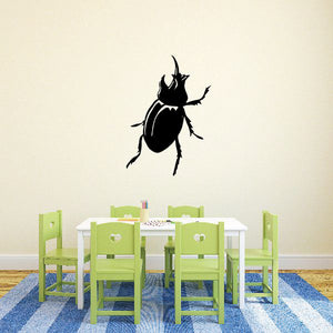 Horned beetle away decal with black beetle silhouette
