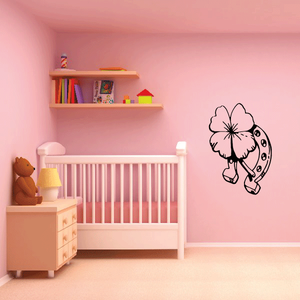 Horseshoe and four-leaf clover wall decal with outlined clover and horseshoe