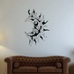 Black moon wall decal with ornate facial design and sharp flame-like shapes