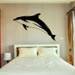 Black hourglass dolphin wall decal with two leaping dolphins