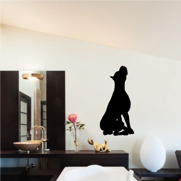 Black boxer dog decal silhouette, sitting howling on a wall