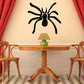 Black spider wall decal with long legs and rounded body