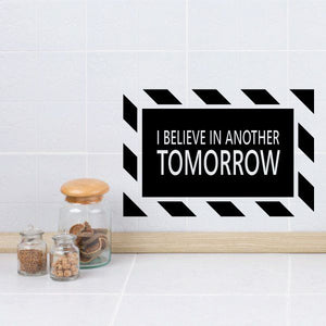 Wall quote decal: “I BELIEVE IN ANOTHER TOMORROW” with striped border