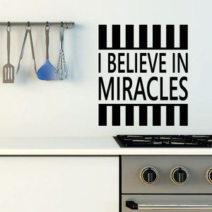 Black quote decal with striped bars and text "I BELIEVE IN MIRACLES".