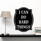 Wall decal with black oval badge and white text: “I CAN DO HARD THINGS”