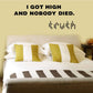 Wall decal featuring bold uppercase text and a small dotted emblem beneath