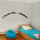 Wall decal with "I Love To Dance" black curved lettering