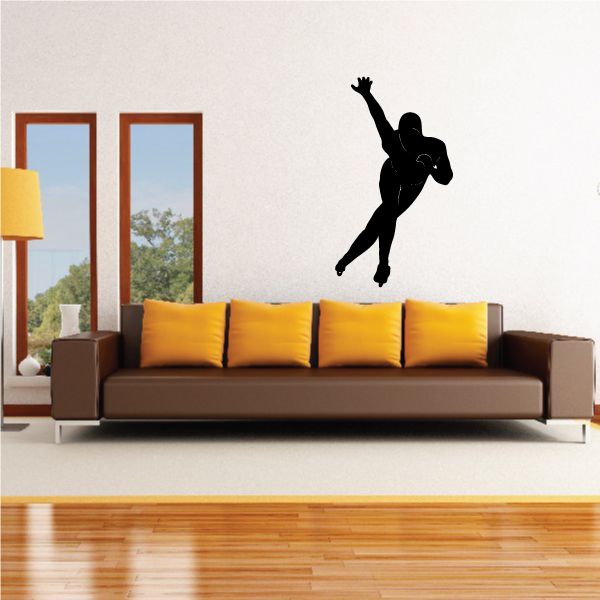 Ice skating wall decal of black skater silhouette in midair