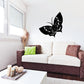Black butterfly wall decal with long antennae and wings spread