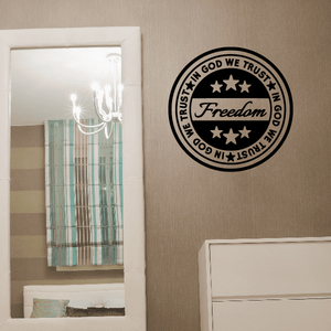 Circular wall decal with "IN GOD WE TRUST" and "Freedom" script inside a black border
