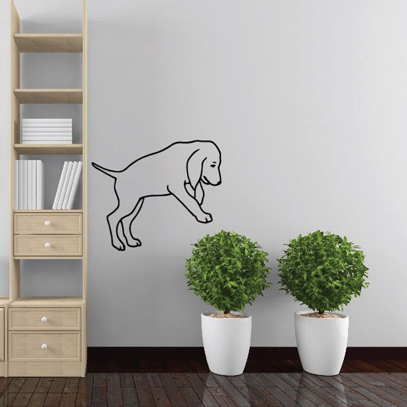 Black line-art puppy decal, curled tail and head lowered