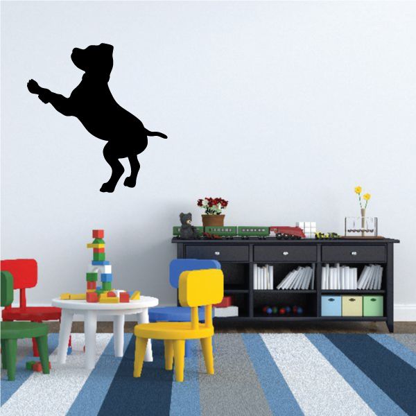 Black puppy silhouette wall decal with tail up and front paw raised