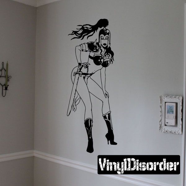 Black line-art warrior woman wall decal with flaming hair and raised weapon