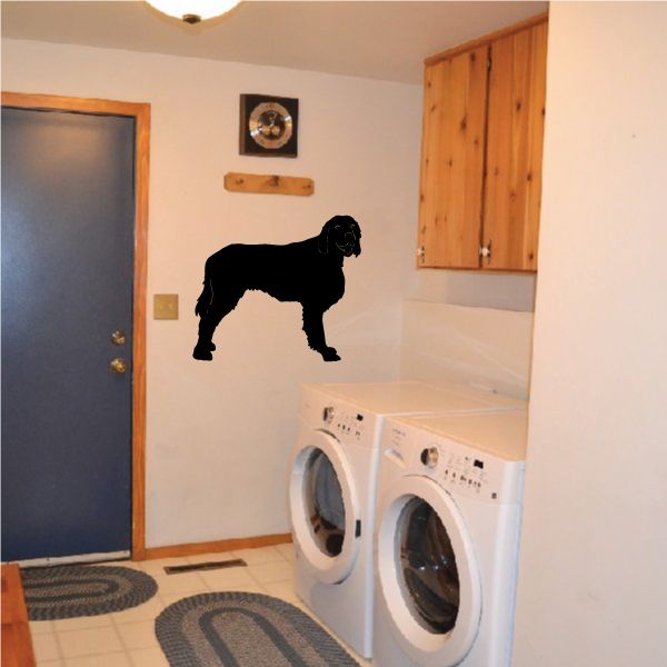 Dog decal in black, looking-over silhouette in a side standing profile