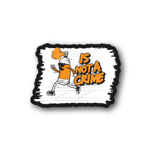 Vinyl sticker showing cartoon character and orange “IS NOT A CRIME” text