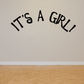 Baby shower wall decal with black text: It's a GRL!