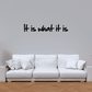 Wall decal with black script text: "It is what it is".