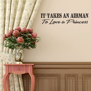 Dark wall decal reading “It Takes an Airman To Love a Princess”