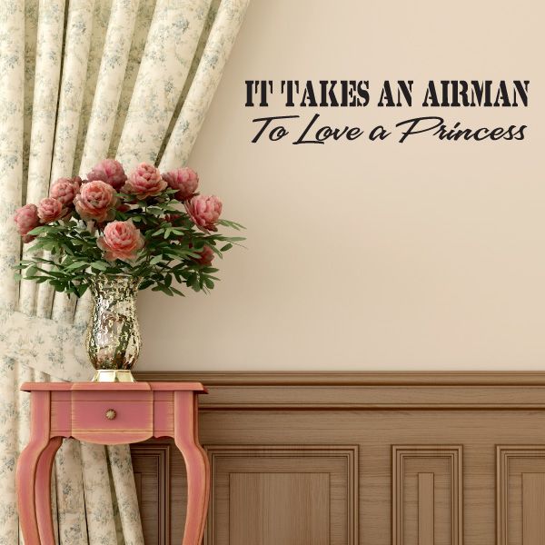 Dark wall decal reading “It Takes an Airman To Love a Princess”