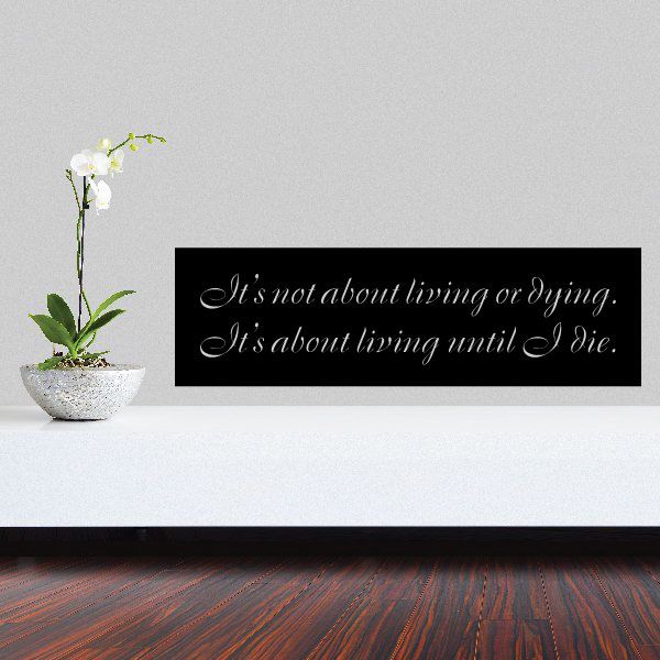 Wall quote decal: black rectangle with white cursive 'living or dying' text.