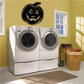 Black jack-o-lantern face wall decal with carved eyes and grin