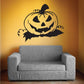 Jack-o-lantern vinyl wall decal with vine accents, black and yellow-orange