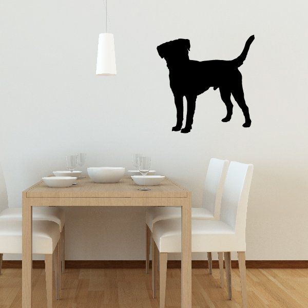 Black dog silhouette decal on light wall