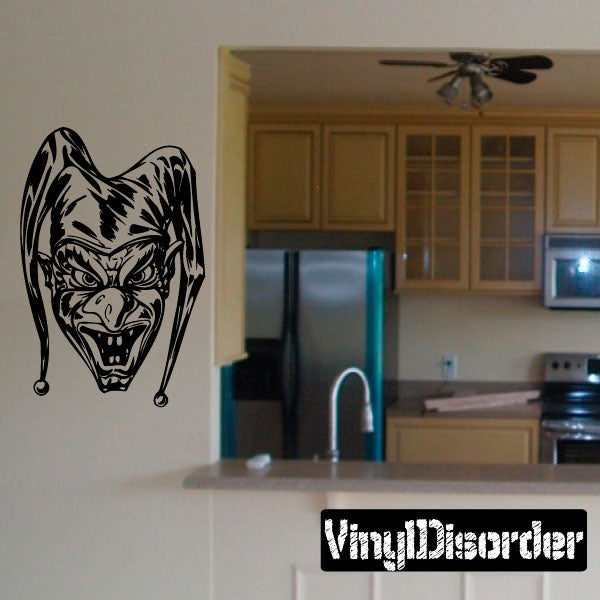 Black jester clown vinyl wall decal with snarling face and curled ear details