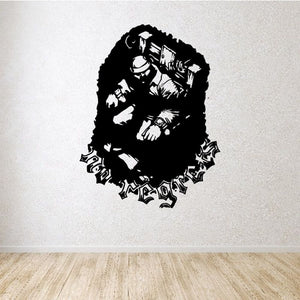 Vinyl wall decal of a black jester silhouette with scattered decorative symbols
