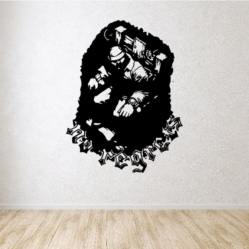 Vinyl wall decal of a black jester silhouette with scattered decorative symbols
