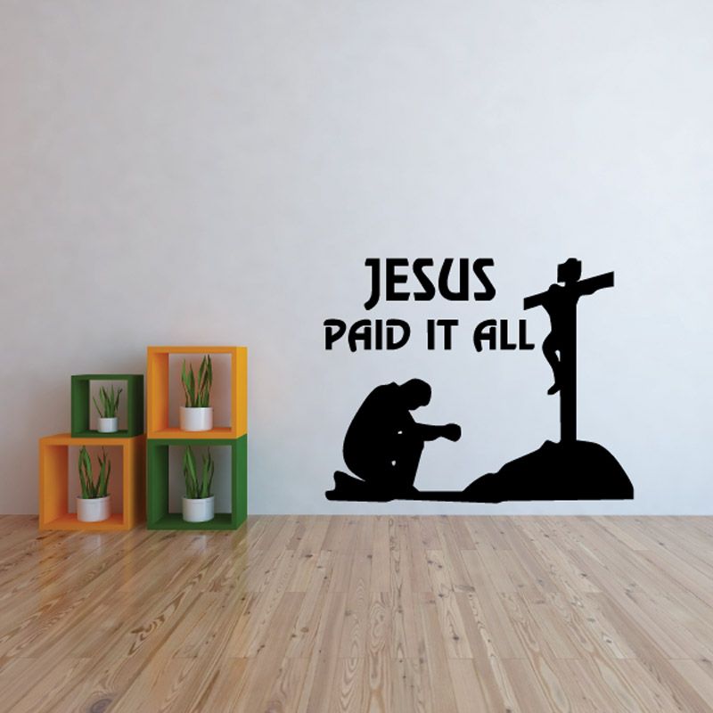 Wall decal with "Jesus paid it all" lettering and black cross silhouette