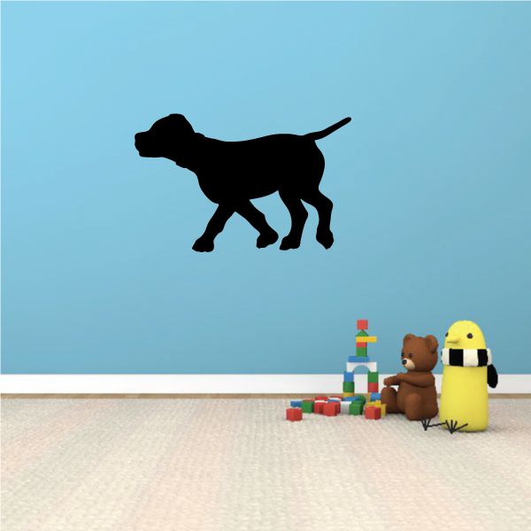 Black jogging puppy decal silhouette in side view, tail raised
