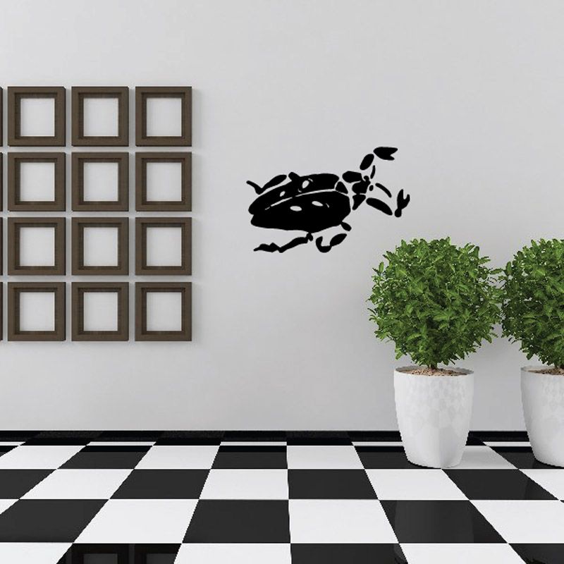 Black jointed cockroach wall decal with segmented legs and antennae