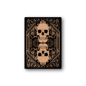 Vinyl skull sticker with ornate gold filigree and joker-style face on black