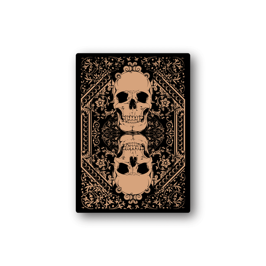 Vinyl skull sticker with ornate gold filigree and joker-style face on black