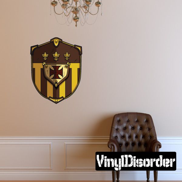 Jousting shield sticker featuring a black and gold crest with a red emblem