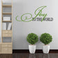 Green script wall decal reading "Joy to the World"