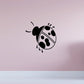 Ladybug decal with black body, white wings, and round spots