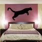 Jumping cougar decal, black silhouette, jumping pose on flat surface