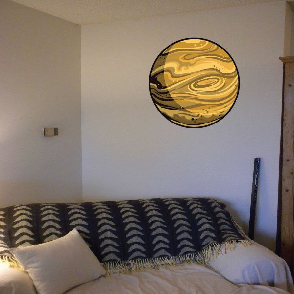 Circular Jupiter sticker with gold and tan planet swirl pattern
