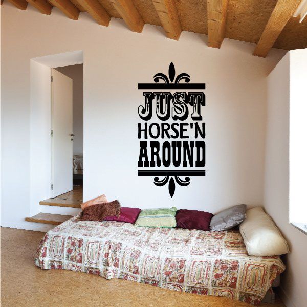Black vinyl wall decal quote “JUST HORSE'N AROUND” with fleur-de-lis accents