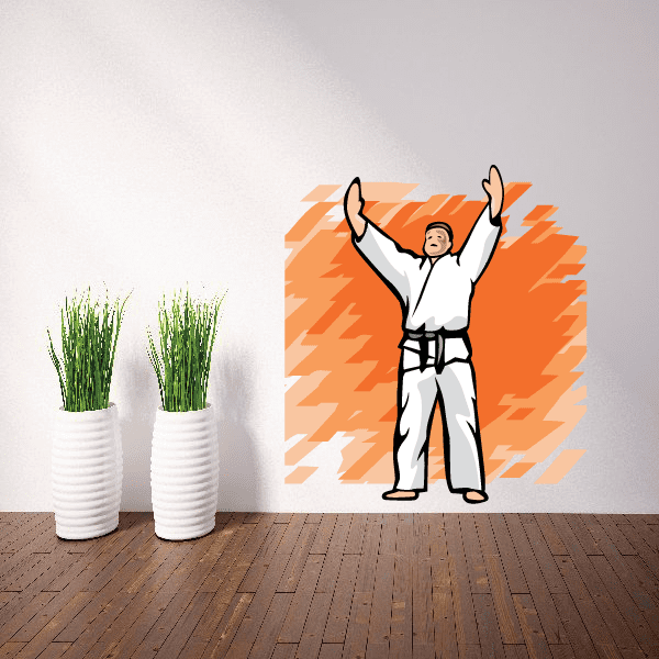 Karate wall decal sticker of a man in white gi with raised arms on orange burst
