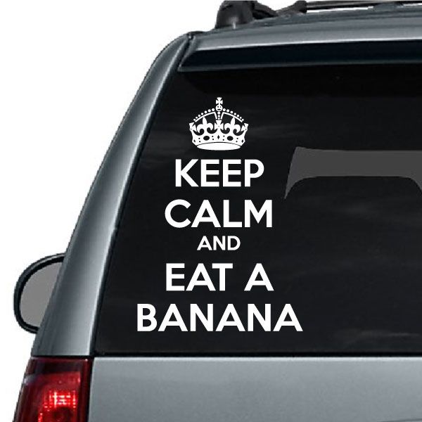 Black car decal: white crown above 'KEEP CALM AND EAT A BANANA' text
