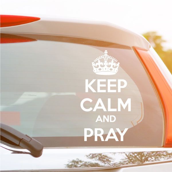Car window decal with crown and text 'Keep Calm and Pray'.