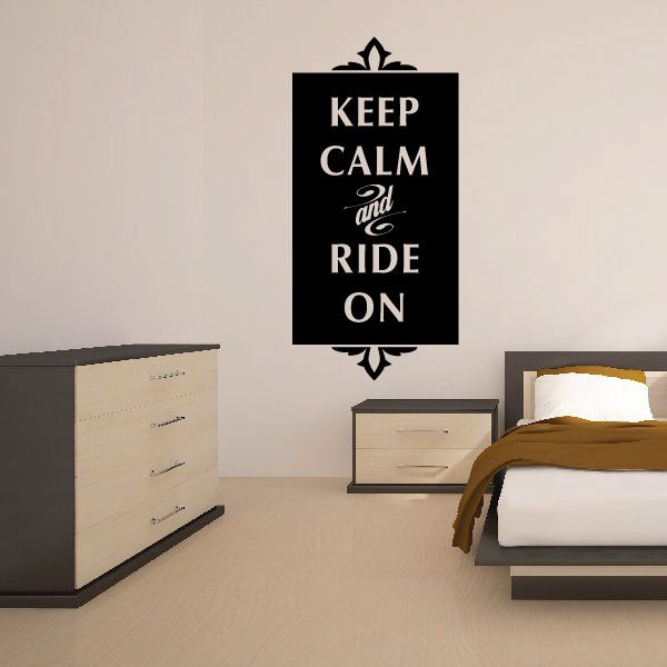 Wall decal with 'KEEP CALM and RIDE ON' quote in white on black