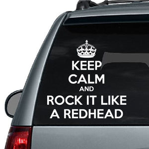 Car decal with crown and white text: “Keep calm and rock it like a redhead”
