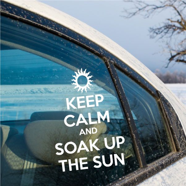 Sun-themed window decal with a white sun icon and text: "KEEP CALM AND SOAK UP THE SUN"