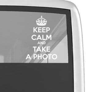 Window decal with crown and white text: Keep calm and take a photo