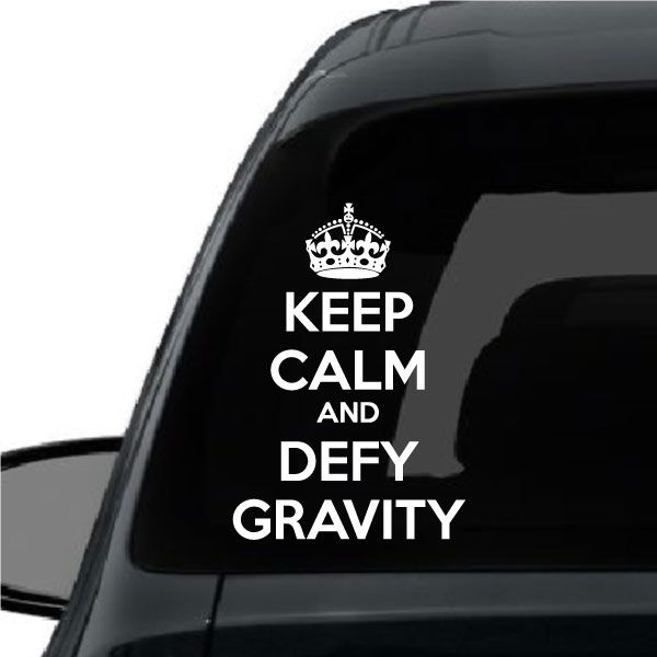 Car window decal with crown and text 'Keep Calm and Defy Gravity'