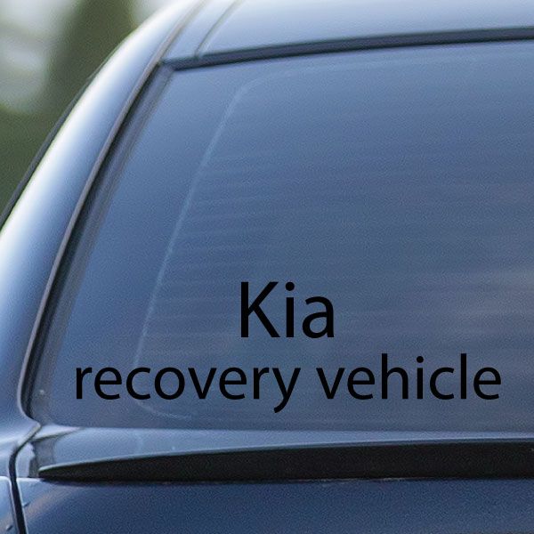 Kia recovery vehicle decal with black text on car window